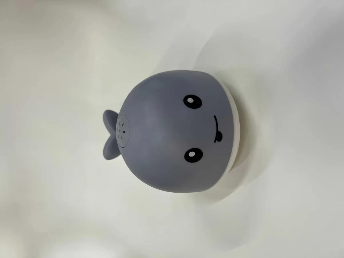 grey light-up whale bath toy