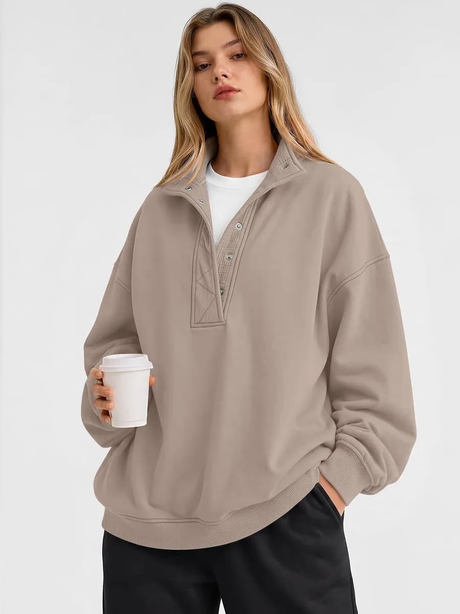 woman wearing an oversized henley sweatshirt
