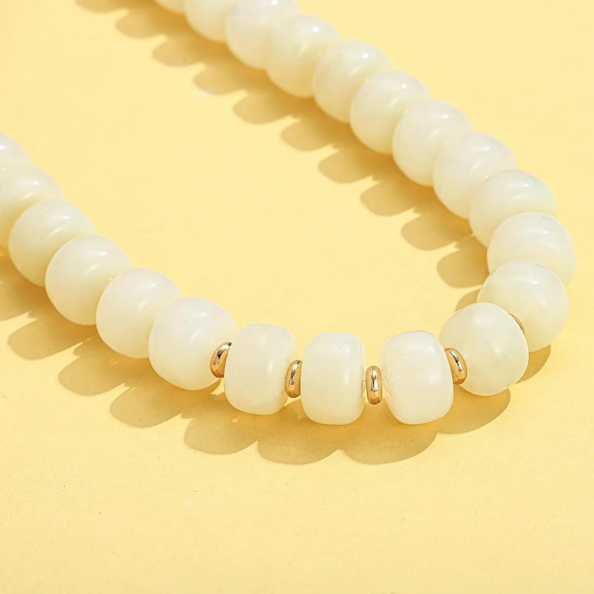 glossy white beads of the chunky necklace, product photo