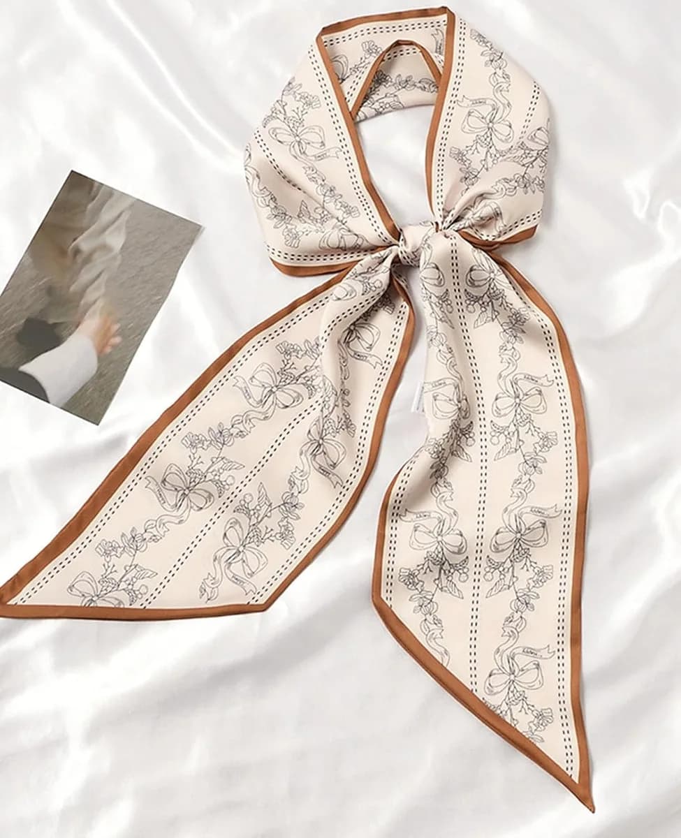 skinny silk feel scarf tied in a bow
