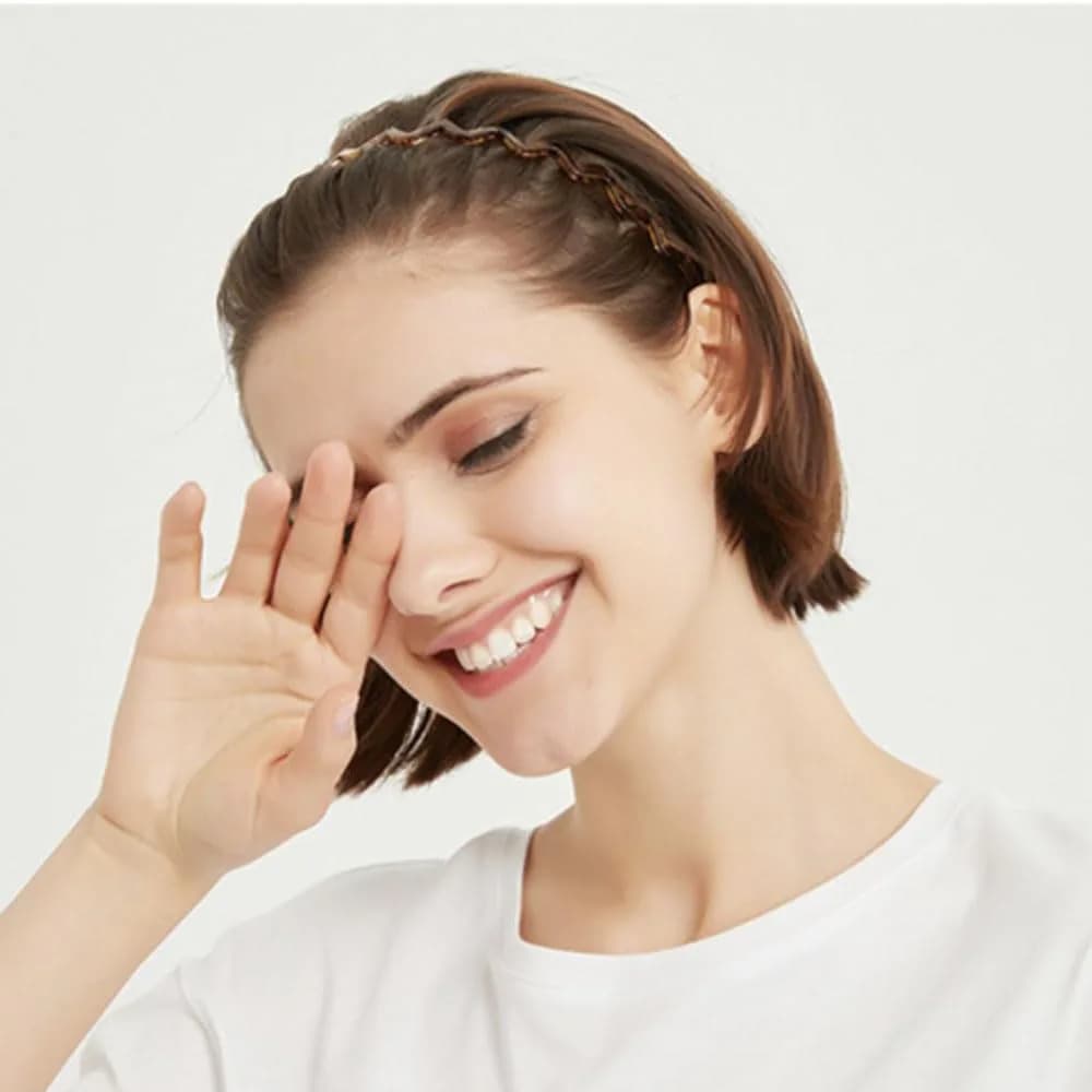 woman wearing a skinny teeth comb headband, product photo