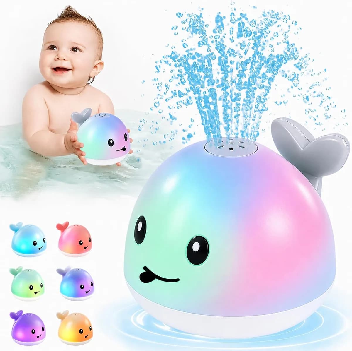 baby playing with a light-up whale bath toy spraying water